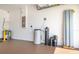 Garage interior with water heater and water softener system on a painted concrete floor at 12119 Barnsley Reserve Pl, Gibsonton, FL 33534
