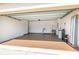 Spacious two car garage with painted floor and walls, and a variety of storage equipment at 12119 Barnsley Reserve Pl, Gibsonton, FL 33534