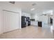 A wide-angle view of the kitchen shows the open-concept layout and appliances at 12119 Barnsley Reserve Pl, Gibsonton, FL 33534