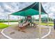 Community playground featuring a slide, climbing structures, and safety surfacing at 12119 Barnsley Reserve Pl, Gibsonton, FL 33534