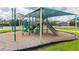 Shaded playground area with a slide and climbing structures for community enjoyment at 12119 Barnsley Reserve Pl, Gibsonton, FL 33534