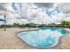 Community pool with inviting blue water, surrounding lounge chairs, and a charming decorative banner at 12119 Barnsley Reserve Pl, Gibsonton, FL 33534