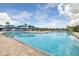 A large, inviting community pool with plenty of seating and a festive, welcoming atmosphere at 12119 Barnsley Reserve Pl, Gibsonton, FL 33534