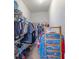 The walk-in closet has plenty of shelving and space to organize your wardrobe at 12119 Barnsley Reserve Pl, Gibsonton, FL 33534