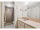 Well-lit bathroom features a step-in shower and vanity with lots of storage at 12141 Spartan Way # 102, Hudson, FL 34667