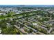 Aerial view showcasing townhome community near Bayside Bridge and pool at 13651 Forest Lake Dr, Largo, FL 33771