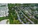 Panoramic aerial shot of community featuring multiple pools and plentiful foliage at 13651 Forest Lake Dr, Largo, FL 33771
