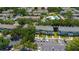 Aerial view of townhome community with pool, playground, and ample parking at 13651 Forest Lake Dr, Largo, FL 33771