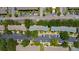 Overhead shot of townhome community, parking, and mature trees at 13651 Forest Lake Dr, Largo, FL 33771