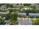 Aerial view of townhome community featuring ample parking and community pool at 13651 Forest Lake Dr, Largo, FL 33771