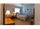 This cozy bedroom features a ceiling fan, a window, and neutral walls and carpet at 13651 Forest Lake Dr, Largo, FL 33771