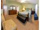 Cozy bedroom with a green accent wall, carpet, vaulted ceiling, and coordinated furniture at 13651 Forest Lake Dr, Largo, FL 33771