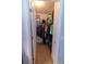Organized walk-in closet with shelving and hanging space for efficient storage solutions at 13651 Forest Lake Dr, Largo, FL 33771