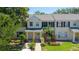 Charming townhome with well-maintained landscaping and a welcoming entrance at 13651 Forest Lake Dr, Largo, FL 33771