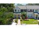 Charming two-story townhome with a landscaped yard and welcoming front entrance at 13651 Forest Lake Dr, Largo, FL 33771
