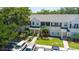 Well-manicured townhome exterior showcasing lush greenery and a welcoming facade at 13651 Forest Lake Dr, Largo, FL 33771