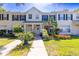 Charming townhome with a well-manicured lawn and colorful flower beds at 13651 Forest Lake Dr, Largo, FL 33771