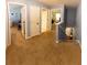 Second floor hallway with multiple doorways and staircase to basement at 13651 Forest Lake Dr, Largo, FL 33771