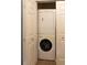 Convenient laundry closet featuring a stacked washer and dryer at 13651 Forest Lake Dr, Largo, FL 33771