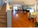 Spacious living room with hardwood floors, staircase, and plenty of natural light at 13651 Forest Lake Dr, Largo, FL 33771