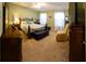 Spacious main bedroom features plush carpet and plenty of natural light at 13651 Forest Lake Dr, Largo, FL 33771