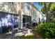 Relaxing screened patio with outdoor seating and views of the greenery at 13651 Forest Lake Dr, Largo, FL 33771