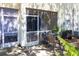 Cozy screened patio with patio furniture and a view of the backyard at 13651 Forest Lake Dr, Largo, FL 33771