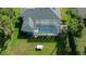 Aerial view highlighting the pool, screened enclosure, patio, and yard at 14178 Pullman Dr, Spring Hill, FL 34609