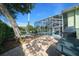 The property includes outdoor seating and a grill near the screened-in pool, perfect for entertaining at 14178 Pullman Dr, Spring Hill, FL 34609