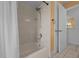 This bathroom features a shower-tub combination with white tile and a shower curtain at 14178 Pullman Dr, Spring Hill, FL 34609