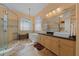 This primary bathroom features tile floors, double vanity and a soaking tub at 14178 Pullman Dr, Spring Hill, FL 34609