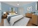 This bedroom features hardwood floors, an accent rug, and neutral blue walls at 14178 Pullman Dr, Spring Hill, FL 34609