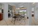 Dining area featuring a table with chairs and sliding glass doors to the patio at 14178 Pullman Dr, Spring Hill, FL 34609