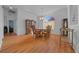 Elegant dining room with hardwood floors, chandelier, and a large window providing natural light at 14178 Pullman Dr, Spring Hill, FL 34609