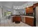 Kitchen featuring stainless steel appliances, wood cabinets, and a sink with backyard view at 14178 Pullman Dr, Spring Hill, FL 34609