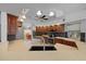 Kitchen showcasing stainless steel appliances, wood cabinets, an island, and open layout at 14178 Pullman Dr, Spring Hill, FL 34609