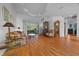 Bright living room with hardwood floors, neutral walls, and ample seating perfect for relaxation and entertaining at 14178 Pullman Dr, Spring Hill, FL 34609