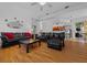 Bright living room featuring a large sofa and an open concept to the kitchen at 14178 Pullman Dr, Spring Hill, FL 34609