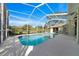 Enjoy Florida living with this screened-in pool, surrounded by a spacious patio and lush landscaping at 14178 Pullman Dr, Spring Hill, FL 34609
