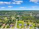 Stunning aerial view of a residential area with mature trees and well-maintained lawns at 1478 Brigadier Dr, Spring Hill, FL 34608