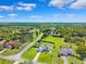 Beautiful aerial view of the property in a peaceful community with lush landscaping and mature trees at 1478 Brigadier Dr, Spring Hill, FL 34608