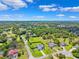 Gorgeous aerial view of the property and surrounding community with mature trees at 1478 Brigadier Dr, Spring Hill, FL 34608
