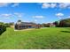 Spacious backyard with a screened pool and patio provides an inviting outdoor living space for relaxation and fun at 1478 Brigadier Dr, Spring Hill, FL 34608