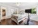 Bedroom featuring a bed, mirror closet, and mounted television at 1478 Brigadier Dr, Spring Hill, FL 34608