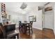 Elegant dining room with shuttered windows, modern lighting, and wood floors at 1478 Brigadier Dr, Spring Hill, FL 34608