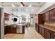 Bright, open-concept kitchen with a view to the living room featuring an island and modern appliances at 1478 Brigadier Dr, Spring Hill, FL 34608