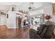Stylish living room featuring decorative wall art, sliding glass doors, and hardwood floors at 1478 Brigadier Dr, Spring Hill, FL 34608