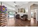 An additional living area leads out to the pool with comfortable seating and lots of light at 1478 Brigadier Dr, Spring Hill, FL 34608
