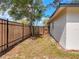 Fenced backyard with mature tree offers both privacy and a place to relax at 1652 Larkin Rd, Spring Hill, FL 34608