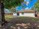 Spacious fenced backyard featuring a well-maintained lawn, with space for outdoor enjoyment at 1652 Larkin Rd, Spring Hill, FL 34608